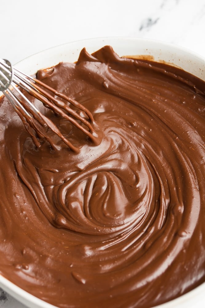 bowl with melty chocolate and a whisk
