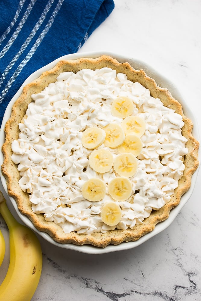 whipped cream and bananas in pie crust