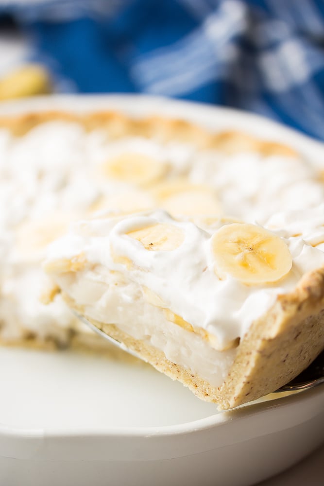 a slice of creamy pie being taken out of pie pan