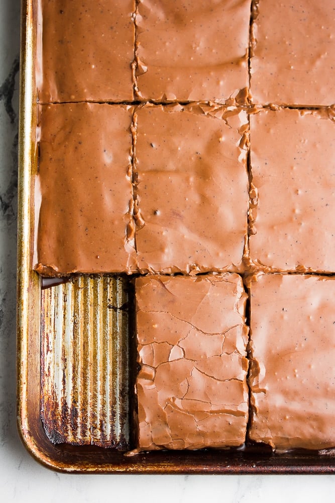 pan with sliced sheet cake, chocolate.