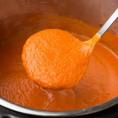 square image of ladle picking up soup from instant pot