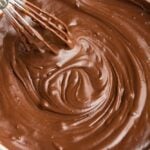 square image of bowl of chocolate ganache with whisk