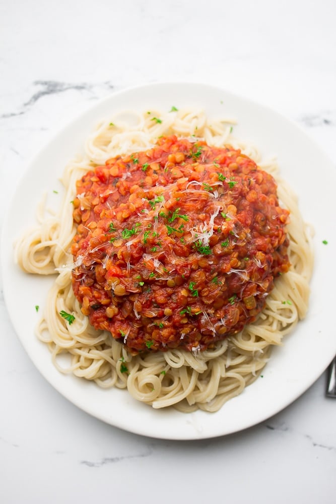 looking down on a big plate of spaghetti and red meaty sauce