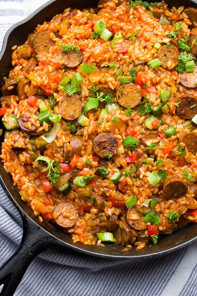 looking down on a big pot of vegan jambalaya in cast iron pan