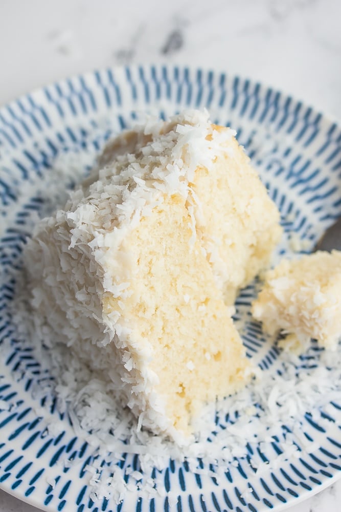 looking down on a piece of coconut cake, bite taken