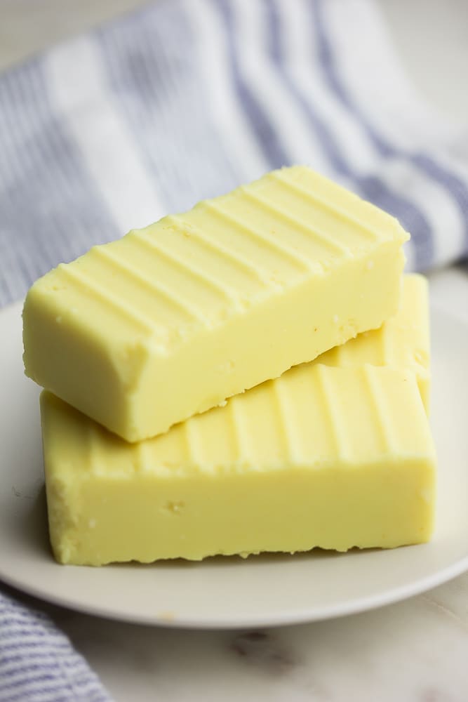 3 sticks of butter with ridges on a plate