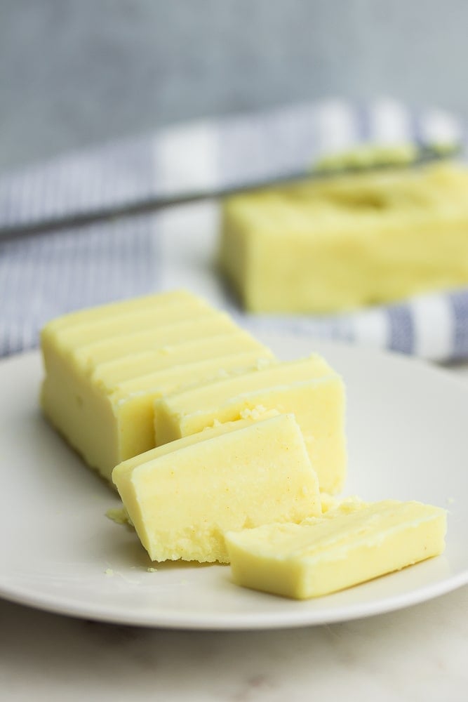 sliced vegan butter on a plate, more in background