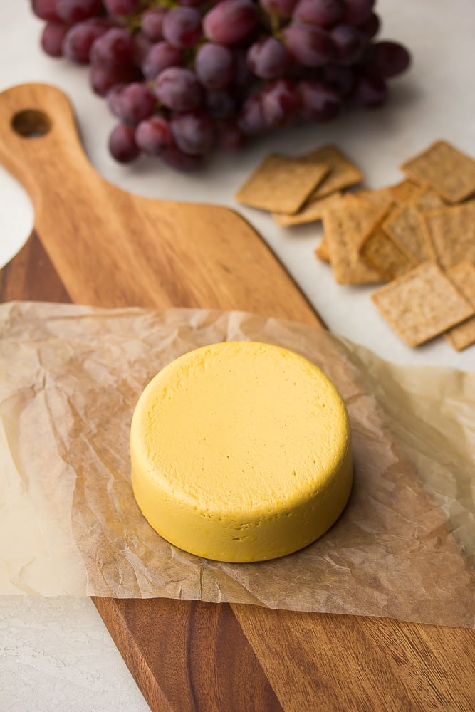 block of cheese on a board