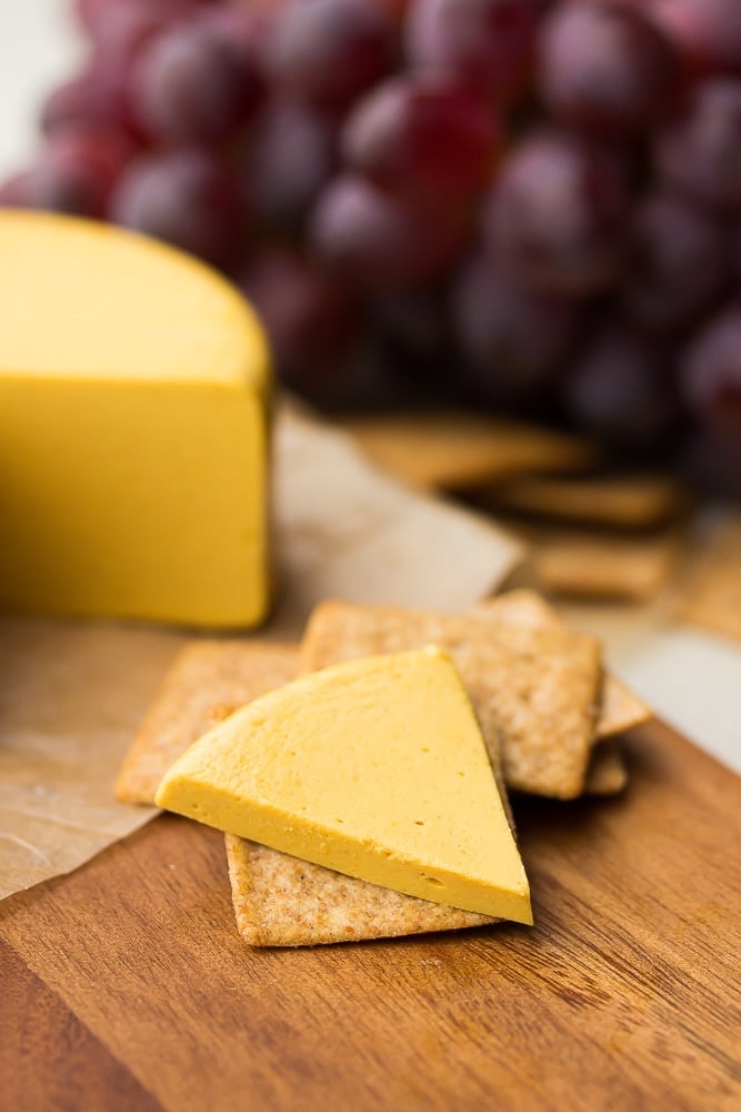 piece of sliced cheddar on a cracker