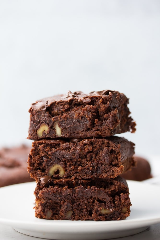 stack of brownies on gray background
