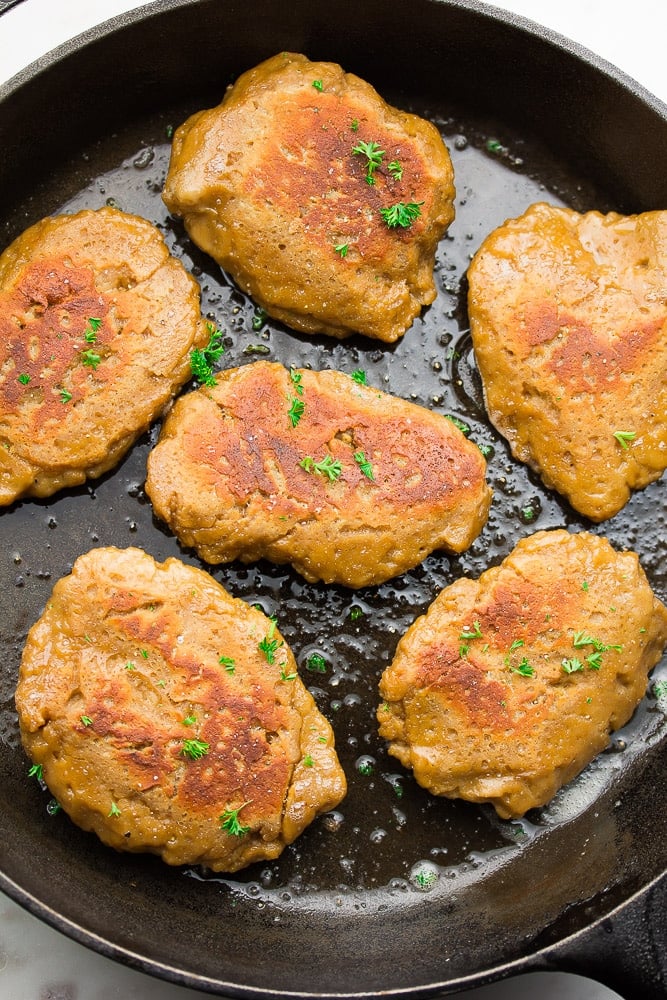 cast iron pan with pieces of cooked "meat"