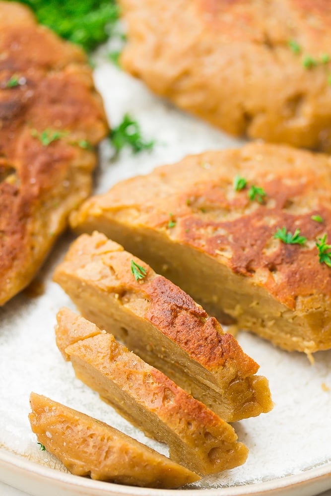 sliced seitan meat on white background