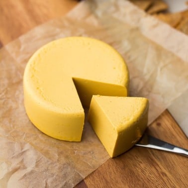 square image of a block of vegan cheddar