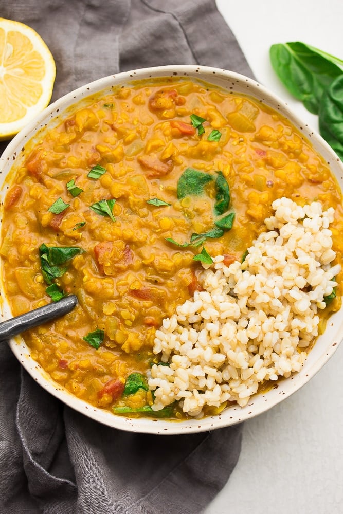 bowl of lentils/spinach and rice on top