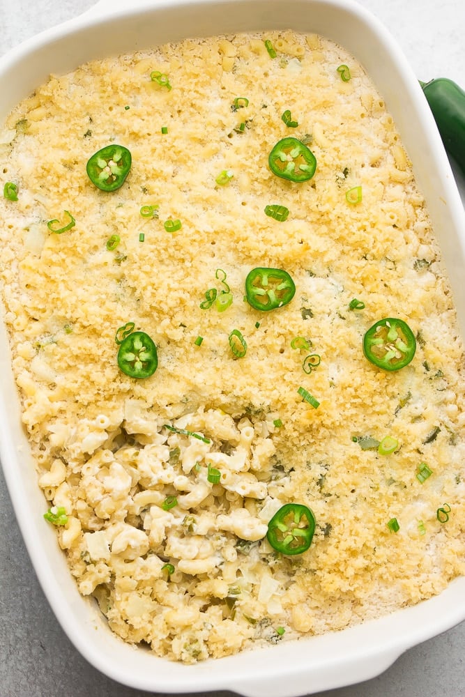 showing whole white casserole dish with baked mac and cheese with jalapenos