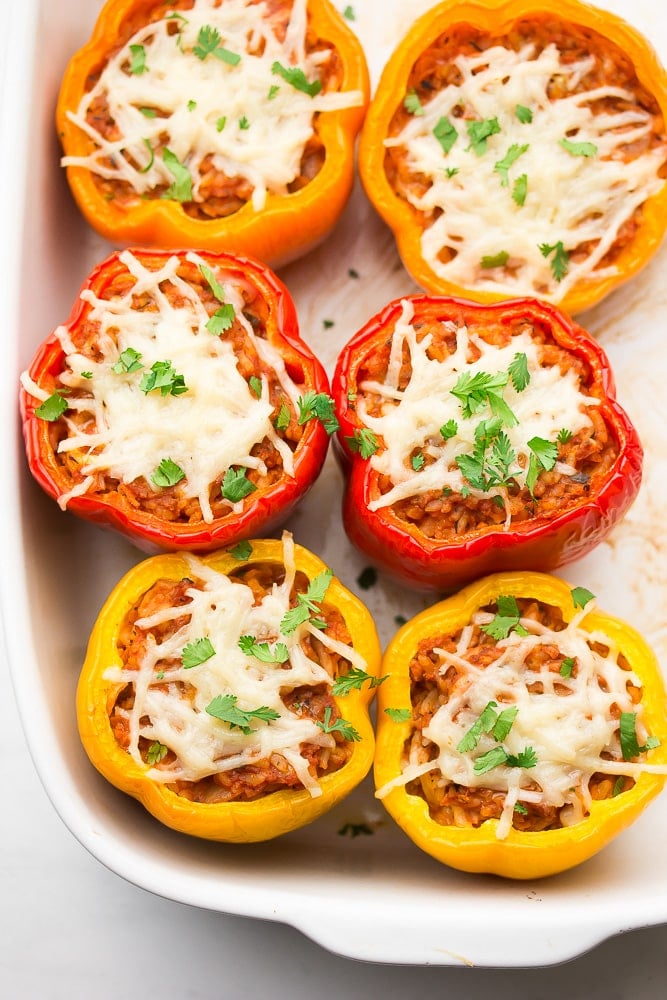 looking at a white dish with cooked vegan stuffed peppers