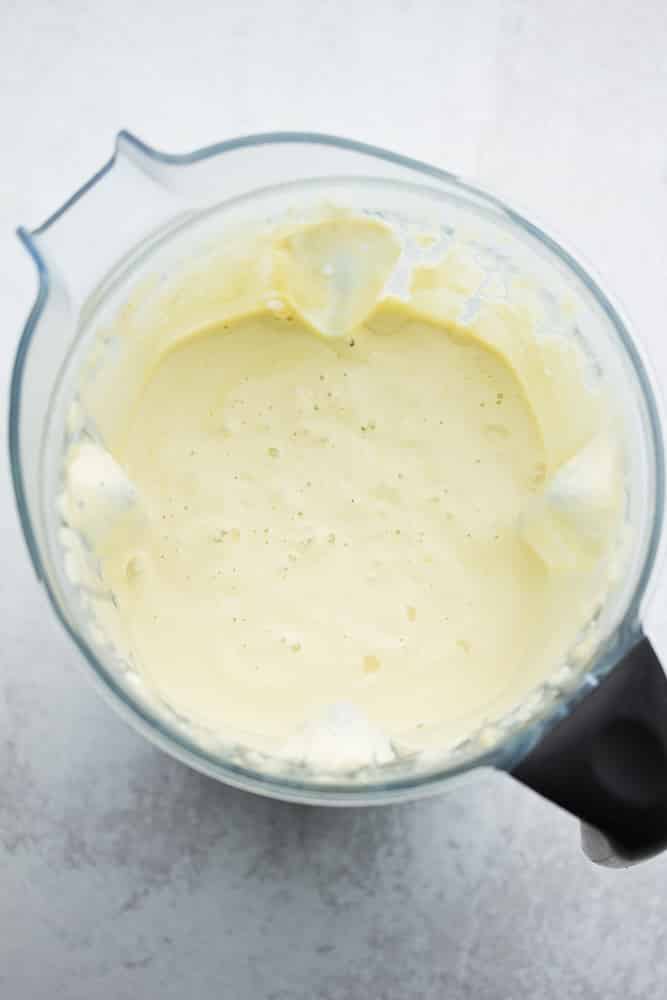 blender full of white creamy sauce