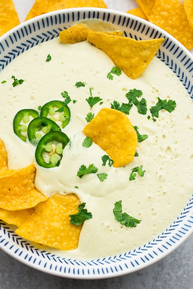 looking down on a bowl of white cheese with cilantro