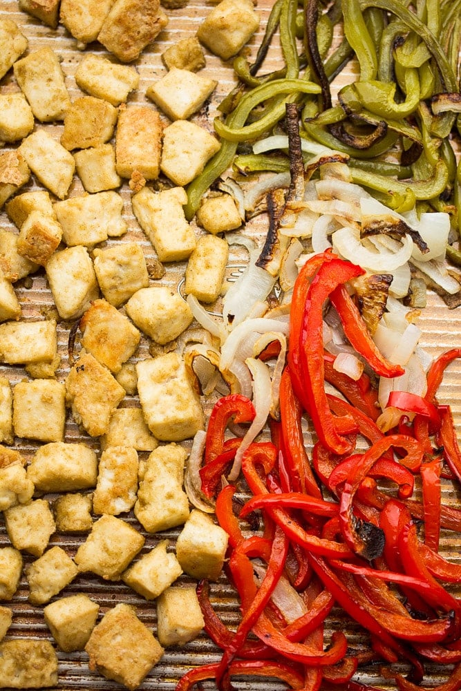 pan full of baked tofu, peppers and onion