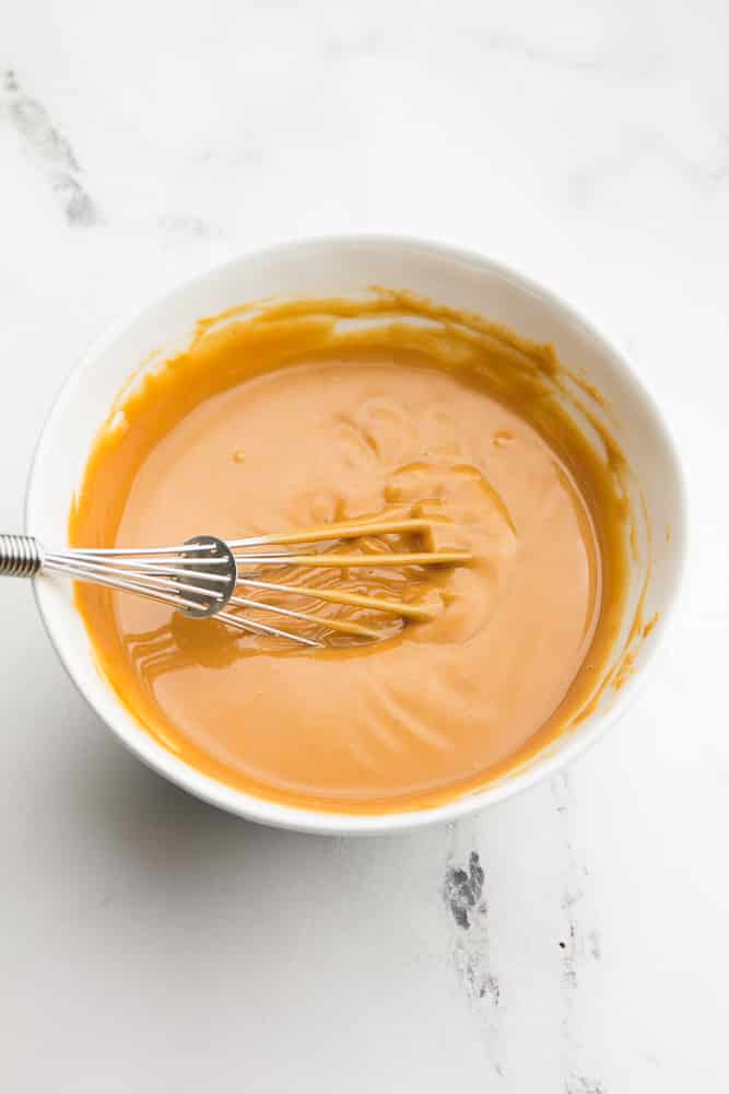 bowl of peanut sauce being whisked