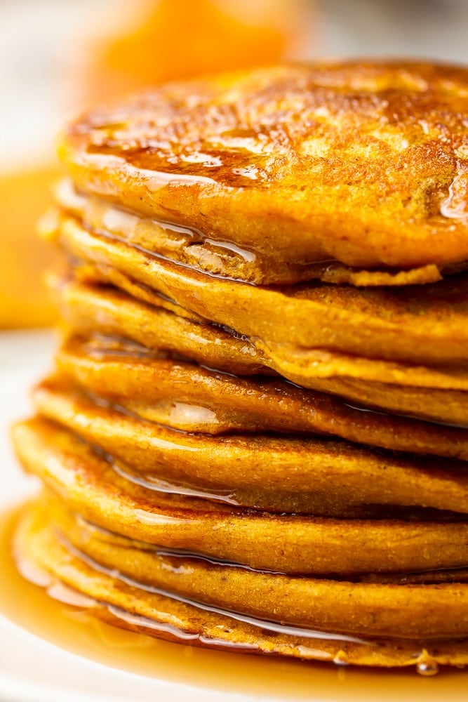 very close up photo of stack of pumpkin pancakes
