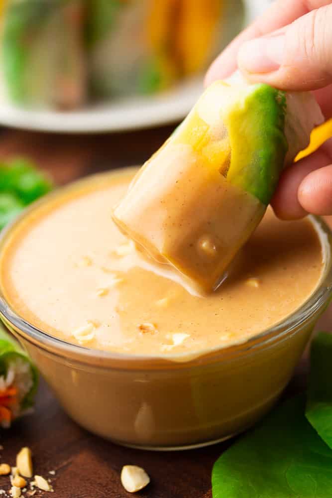 a dipped roll with peanut sauce all over it