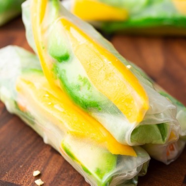 square photo of 3 fresh rolls with mango