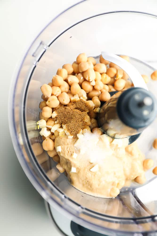 food processor full of hummus ingredients