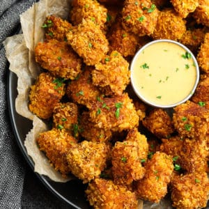 square image of breaded tofu with dip