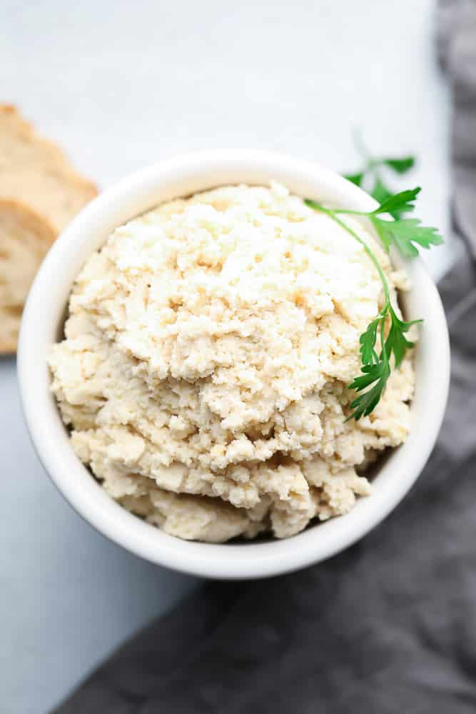 looking down on a bowl of almond based cheese