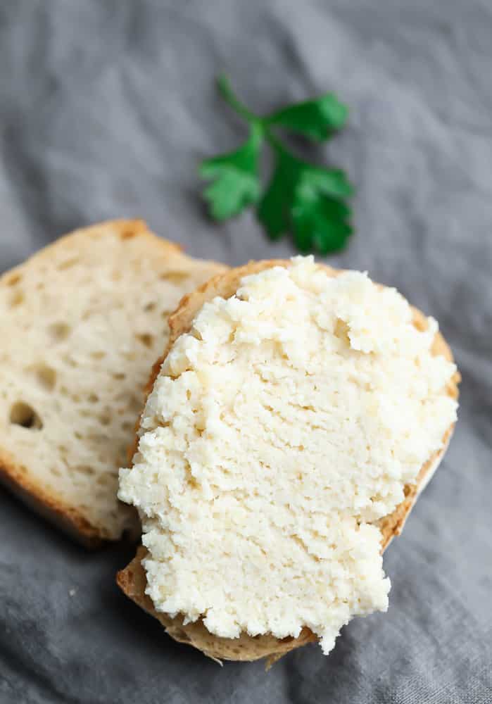 two small slices of bread with ricotta on top