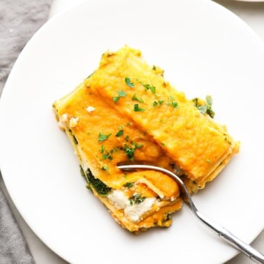 square image of butternut squash lasagna on a plate