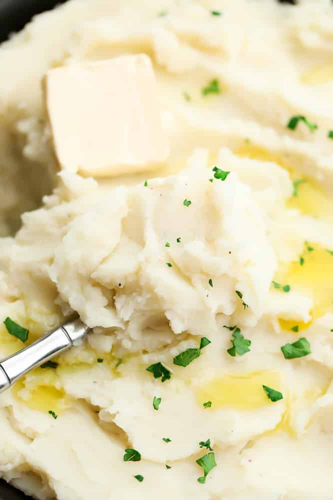 spoon in bowl of potatoes