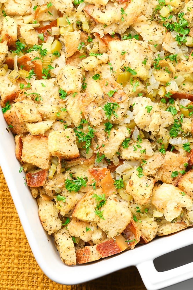 overhead view of vegan stuffing in a white casserole dish.