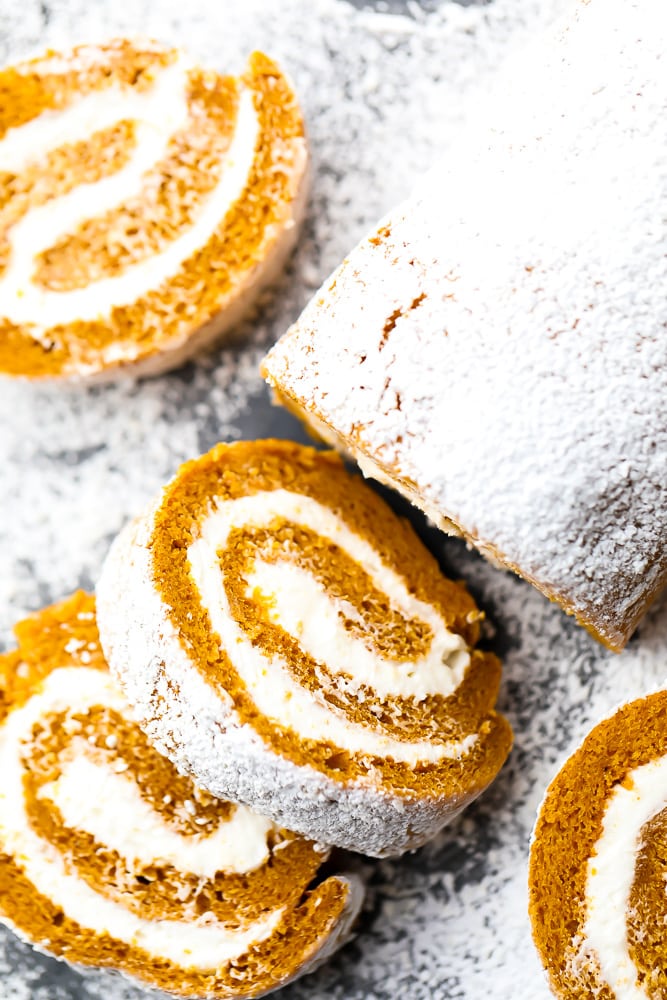 looking down on a pumpkin roll, partially sliced