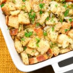 square image of stuffing in white casserole dish