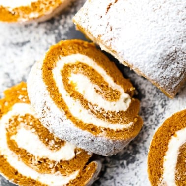 square image of rolled cake with white frosting