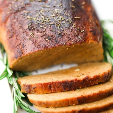 square image of vegan turkey loaf on white plate