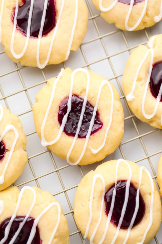 glazed cookies with jam on a cooling rack
