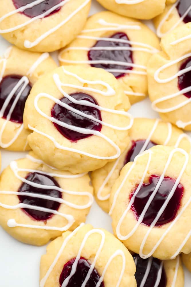 lots of vegan thumbprint cookies with jam and glaze