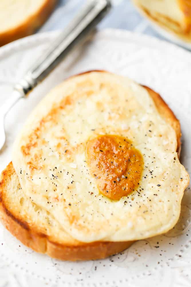 vegan fried egg on a piece of toast with a fork