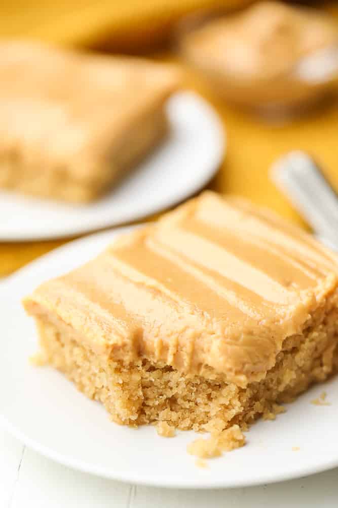 sheet cake on a plate with more in background