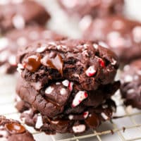 chocolate peppermint cookies, one bit into, with candy cane pieces