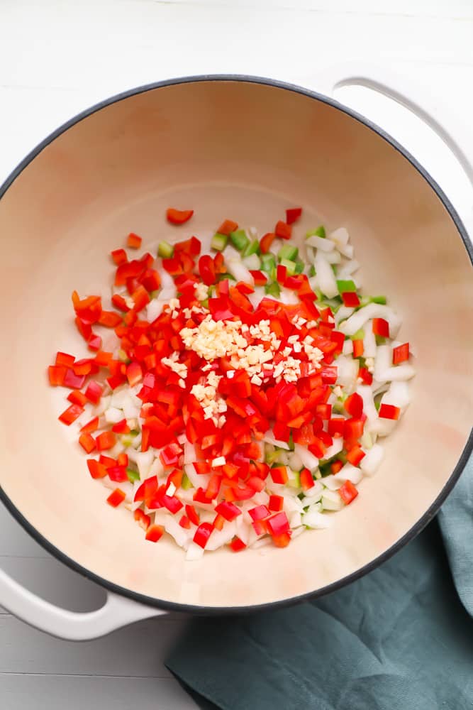 red pepper, onion and celery in a pot uncooked