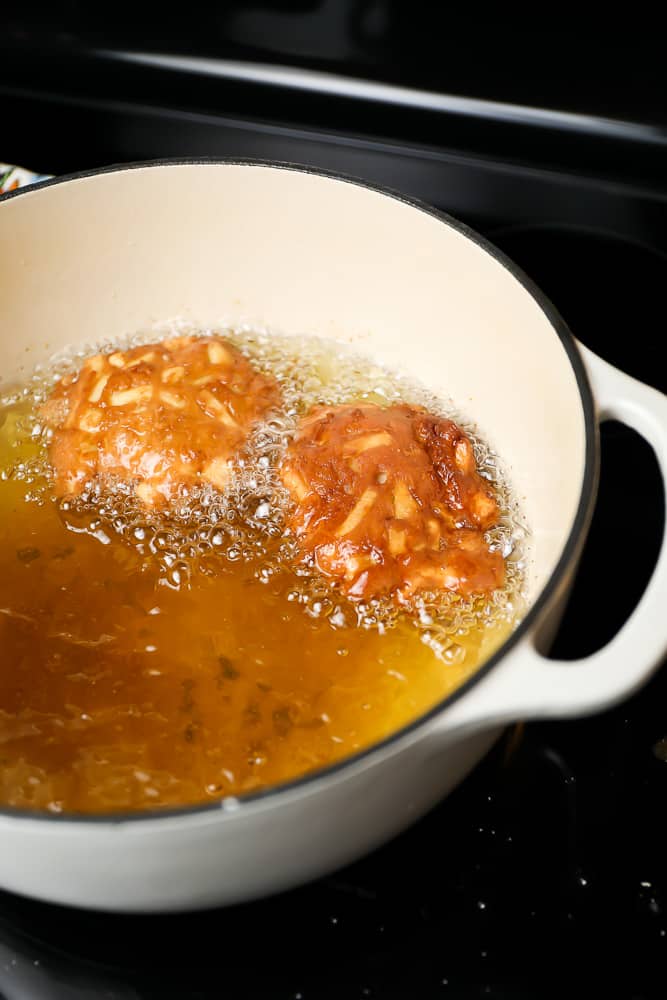 frying donuts in a large pot