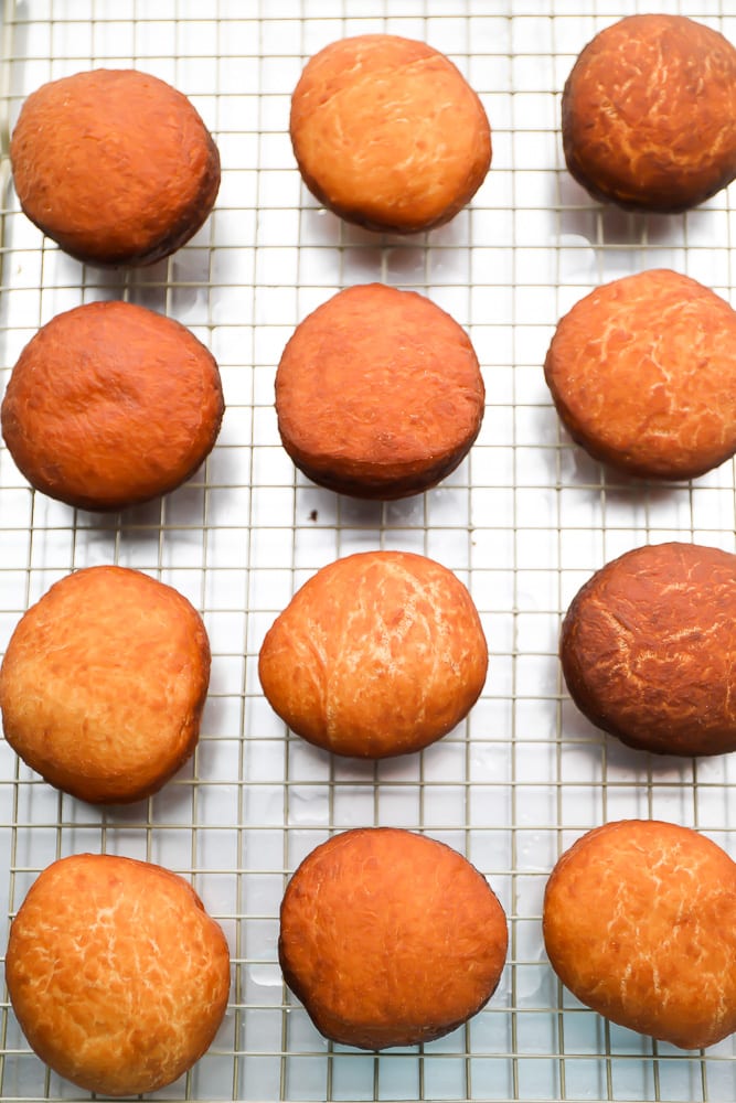 cooked, fried donuts on a rack