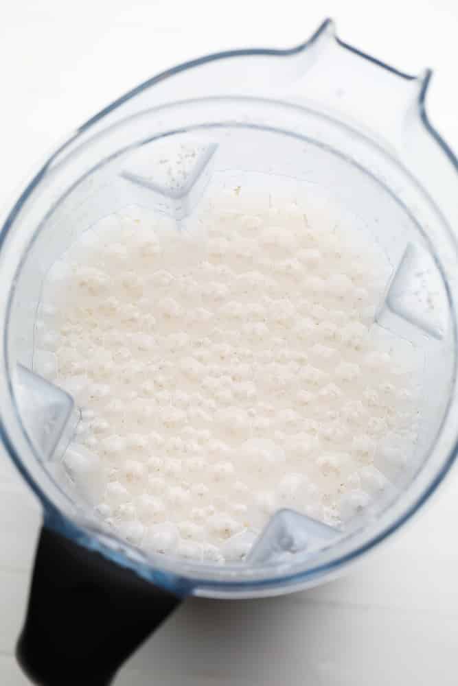 blended white watery creamy mixture in a blender