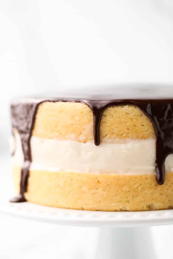 close up of boston cream pie with marble white background