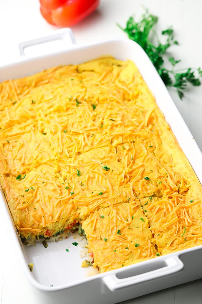 casserole dish with one slice missing of breakfast mixture