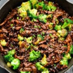 square image of vegan beef and broccoli in cast iron pan